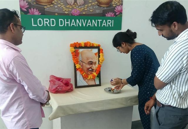 Garlanding the portrait of Mahatma Gandhi